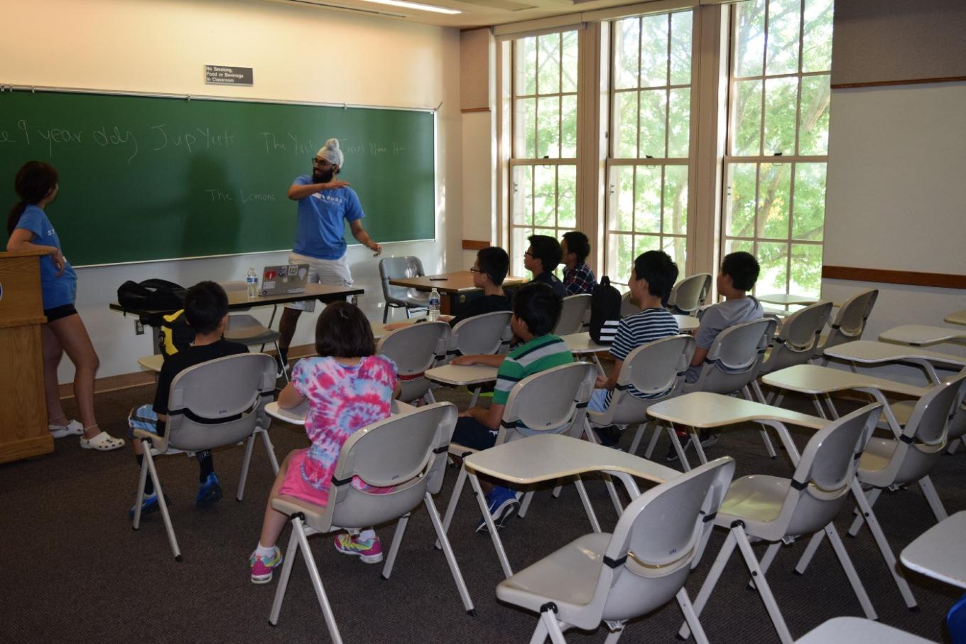 Ashna Patel in a classroom engaging young people with STEM